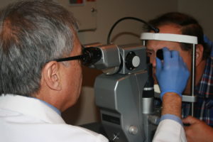 Dr Wing performing an eye exam